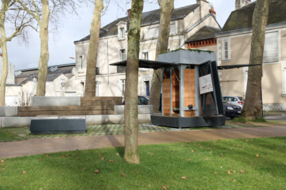 EKOVORE collective composter on Place Ney in Angers The compost bin's two tailgates are open, revealing the biowaste bins inside.