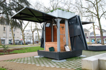 EKOVORE collective composter on Place Ney in Angers The two compost hatch covers are open to reveal the maturing silo inside the composter.