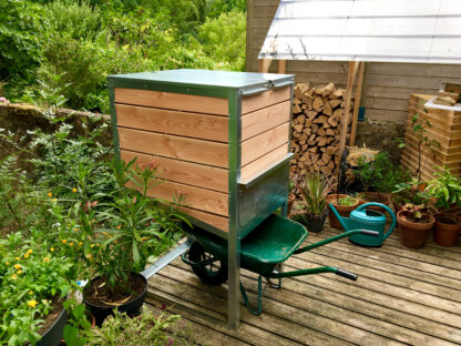 Ekovore 500-litre individual composter installed on a terrace and able to accommodate a wheelbarrow for easy emptying