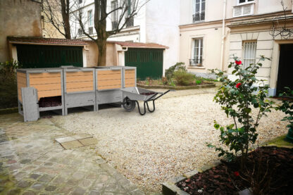 Ekovore modular collective composter installed in a condominium courtyard | This composter is made up of 3 modules of 550L|110 and one module of 275L|110.